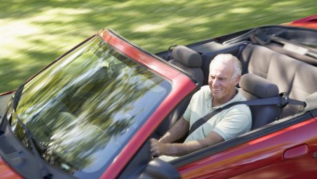 Man in convertible car smiling Man in convertible car smiling